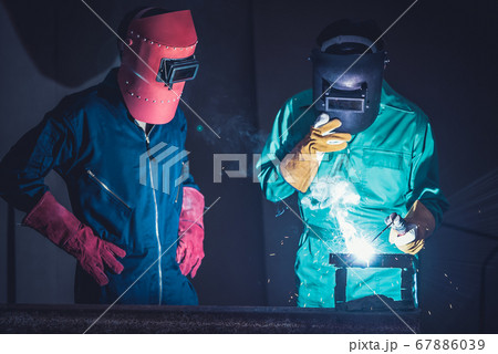 Metal welding steel works using electric arc welding machine Metal welding steel works using electric arc welding machine 67886039
