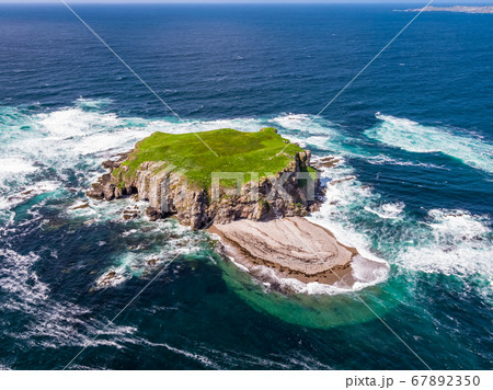 Aerial of Glashedy Island , an uninhabitated island west of Trawbreaga Bay - Donegal, Ireland 67892350