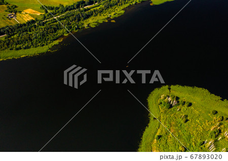 Top view of lake Drivyaty in the Braslav lakes National Park, the most beautiful lakes in Belarus.An island in the lake.Belarus. Top view of lake Drivyaty in the Braslav lakes National Park, the most beautiful lakes in Belarus.An island in the lake.Belarus. 67893020