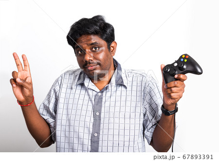 black man funny use hand playing video game pad 67893391