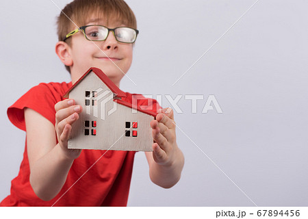 Happy boy shows model home. Real estate, family Happy boy shows model home. Real estate, family 67894456