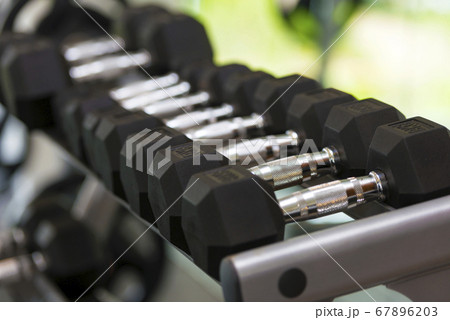 Close up view of dumbbells on the rack Close up view of dumbbells on the rack 67896203