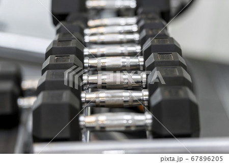 Close up view of dumbbells on the rack Close up view of dumbbells on the rack 67896205