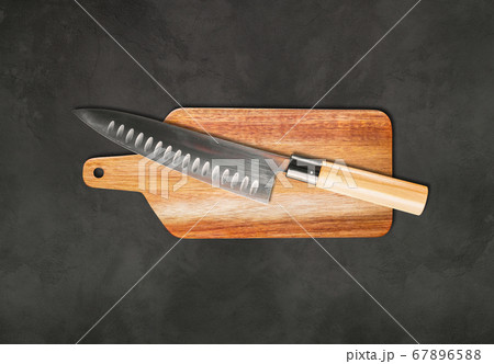 Traditional Japanese gyuto chief knife on a Traditional Japanese gyuto chief knife on a 67896588