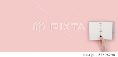 Woman hands with blank notepad mockup Woman hands with blank notepad mockup 67898290