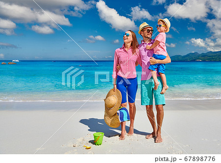 Family with three year old boy on beach. Family with three year old boy on beach. 67898776