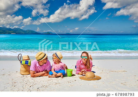 Family with three year old boy on beach. Family with three year old boy on beach. 67898793