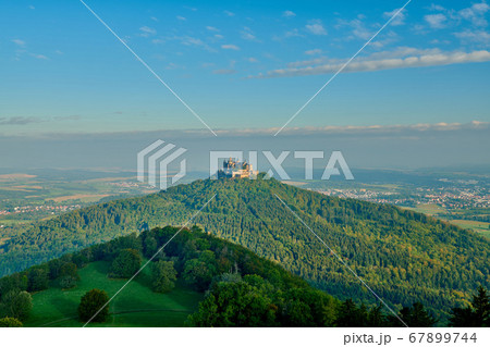 Hilltop Hohenzollern Castle on mountain top in Hilltop Hohenzollern Castle on mountain top in 67899744