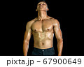 Muscle bodybuilder asia men posing muscle front on the black background. Body gym big chest and 67900649