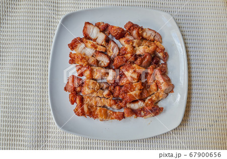 fried pork belly on white dish. top view, Traditional Roasted streaky pork 67900656