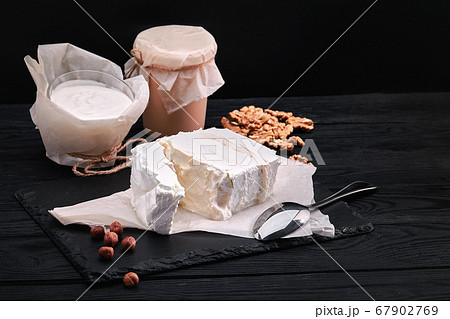Assorted dairy products milk, yogurt, cottage cheese, sour cream. Rustic still life. Farmer's cow dairy products. 67902769