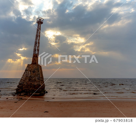 Old lighthouse on the Baltic coast in spring 67903818