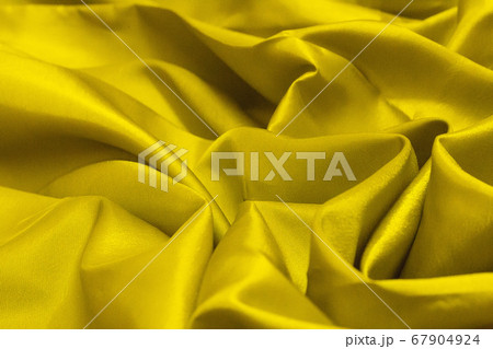 Close up of the crease of natural gold fabric linen texture for design. sackcloth textured. Golden Canvas for Background. 67904924