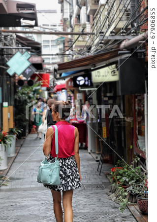 Chinese woman walking in Shanghai shopping street 67906855