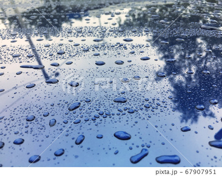 Water drops at blue car paint. Polishing and detailing cars Water drops at blue car paint. Polishing and detailing cars 67907951