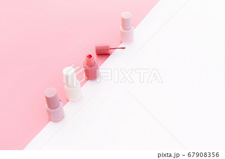 Trendy design template with pink nail polish layout on pastel pink and white background. Copy space. 67908356