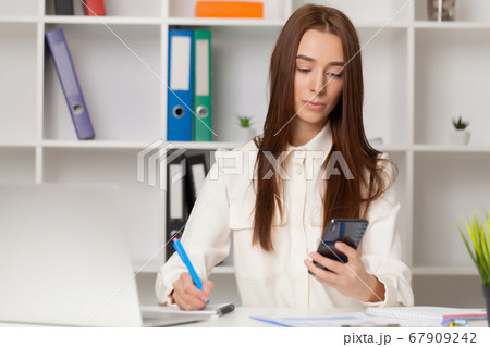 Young girl working in a light office 67909242
