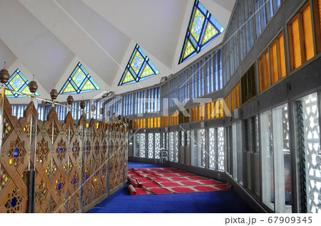KUALA LUMPUR, MALAYSIA -JANUARY 05, 2015: Interior of National Mosque of Malaysia or Masjid Negara. The mosque located in Kuala Lumpur, Malaysia. Built in 1965 and has a capacity of 15,000 people. KUALA LUMPUR, MALAYSIA -JANUARY 05, 2015: Interior of National Mosque of Malaysia or Masjid Negara. The mosque located in Kuala Lumpur, Malaysia. Built in 1965 and has a capacity of 15,000 people. 67909345