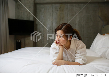 woman work from home on the bed woman work from home on the bed 67920691