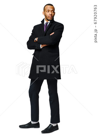 full length studio shot of a african-american businessman wearing coat Isolated on white background 67920763