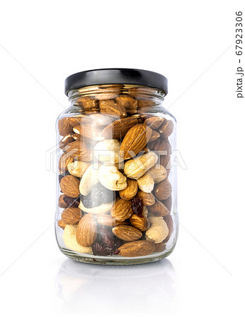 Clear glass bottle with mixed nuts healthy organic food 67923306
