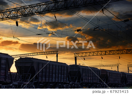 railway and cars in a beautiful sunset, dramatic 67925415