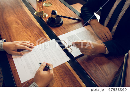 Lawyer is explaining about the wrongdoing laws Lawyer is explaining about the wrongdoing laws 67928360