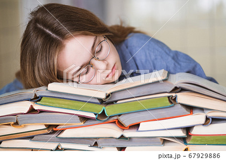 Stressed college student tired of hard learning 67929886