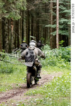 group of motorcyclists in helmets rides on a 67930769
