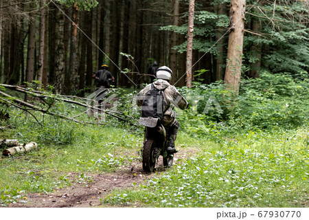 group of motorcyclists in helmets rides on a 67930770