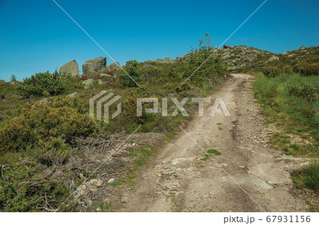 Trail passing through rocky terrain on highlands 67931156