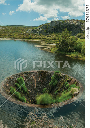 Large sinkhole in a dam lake on the highlands Large sinkhole in a dam lake on the highlands 67931375