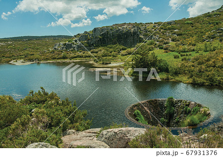 Large sinkhole in a dam lake on the highlands Large sinkhole in a dam lake on the highlands 67931376