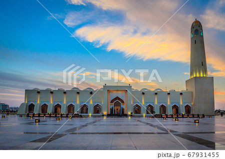 Qatar State Mosque (Imam Muhammad ibn Abd al-Wahhab Mosque) exterior view at sunset with clouds in the sky Qatar State Mosque (Imam Muhammad ibn Abd al-Wahhab Mosque) exterior view at sunset with clouds in the sky 67931455