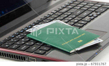 green passport on the keyboard green passport on the keyboard 67931767