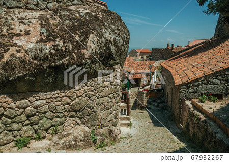 Old houses and stone wall with big rock in Monsanto Old houses and stone wall with big rock in Monsanto 67932267