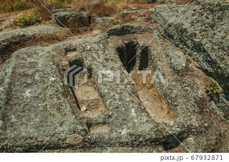 Ancient tombs for child and adult carved in stone Ancient tombs for child and adult carved in stone 67932871