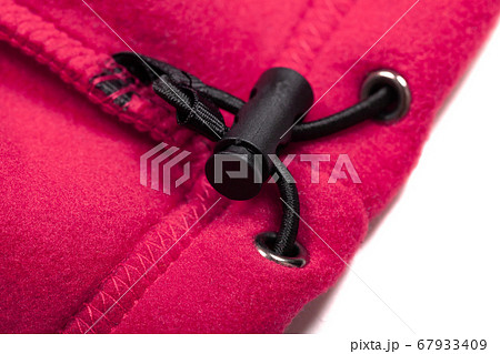 Inner drawcord of a pink sports jacket, close-up Inner drawcord of a pink sports jacket, close-up 67933409