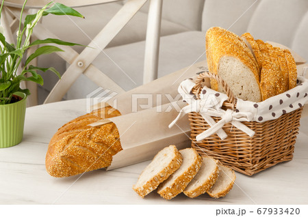 bread in a wicker basket 67933420
