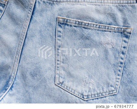 This is a pocket on men's jeans. Denim is light blue. Flatlay. This is a pocket on men's jeans. Denim is light blue. Flatlay. 67934777
