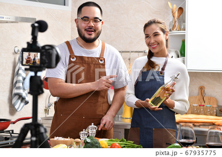 Asian couple blogger vlogger and online influencer recording video content on healthy food Asian couple blogger vlogger and online influencer recording video content on healthy food 67935775