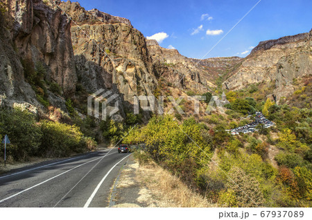 Road to the monastery of Geghard through the rocks in the mountains of Geghama ridge in Armenia Road to the monastery of Geghard through the rocks in the mountains of Geghama ridge in Armenia 67937089