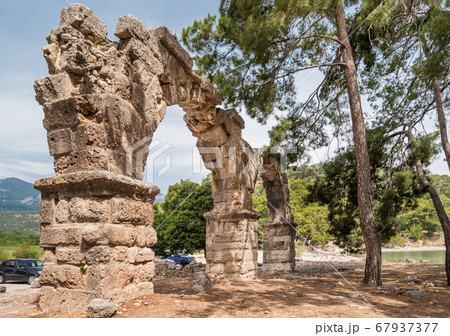 Ruins of aqueduct of ancient Phaselis city. Famous architectural landmark, Kemer district, Antalya province. Turkey. Ruins of aqueduct of ancient Phaselis city. Famous architectural landmark, Kemer district, Antalya province. Turkey. 67937377