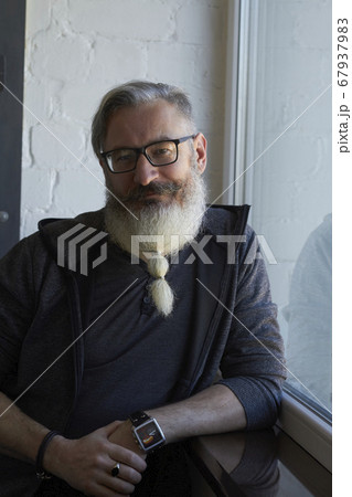 Half-length portrait of mature gray-haired man Half-length portrait of mature gray-haired man 67937983