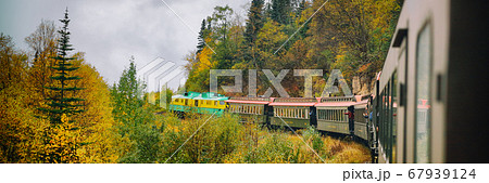 Alaska train White Pass and Yukon route railroad railway ride on old transport rails in Alaska, USA. Nature landscape of Alaska travel cruise shore excursion panorama banner Alaska train White Pass and Yukon route railroad railway ride on old transport rails in Alaska, USA. Nature landscape of Alaska travel cruise shore excursion panorama banner 67939124