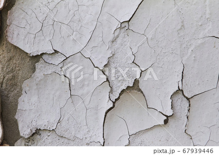 Old flaky cracked paint on gray wall, old paint 67939446