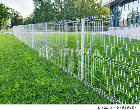 grating wire industrial fence panels, pvc metal fence panel and neatly trimmed lawn. grating wire industrial fence panels, pvc metal fence panel and neatly trimmed lawn. 67939587