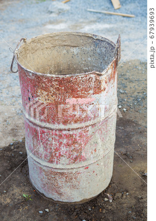 An old rusty metal barrel covered with 67939693