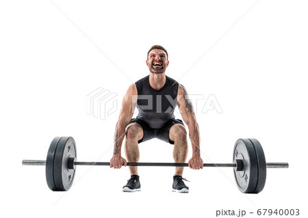 Fit Man Doing A Deadlift Exercise. Full length studio shot isolated on white Fit Man Doing A Deadlift Exercise. Full length studio shot isolated on white 67940003