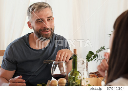 Couple having dinner at home Couple having dinner at home 67941304